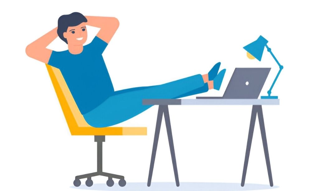 Freelancer resting during break time in front of a slow computer, symbolizing the effects of irregular sleep schedules on energy and productivity. The image reflects the need for a fixed sleep routine to avoid burnout and boost performance