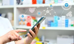 Pharmacist using digital tablet to manage prescriptions in a modern pharmacy—representing how healthcare professionals use digital marketing tools to attract patients in 2026